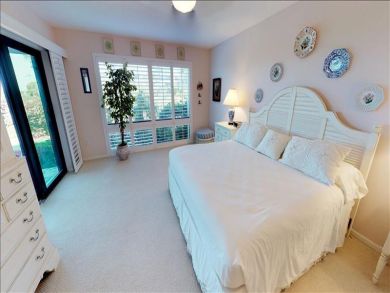 Just Steps to the Sandy Beach from this Two Bedroom Condo